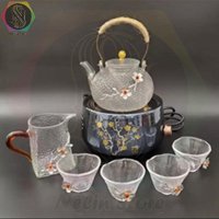 ست چای خوری سلطنتی قوری شیشه ای بوروسیلیکات همراه پارچ شیشه ای و 6 عدد فنجان وگرمکن برقی با گلهای برجسته روکش دار